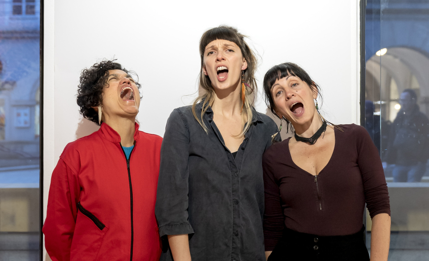 Three People making different expressions with their faces.