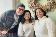 Three people posing for the photo