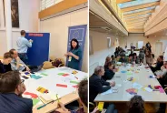 Workshop-Sitzung mit mehreren Personen, Diskussion um einen Tisch, bunten Materialien.